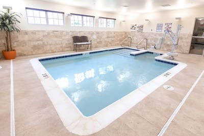 Indoor pool area with accessible lift