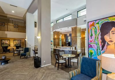 Interior of a common area with art and seating