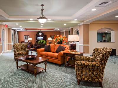Bright common area with comfortable seating and decor