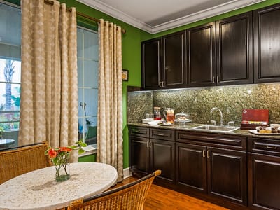 Cozy common area with a small table and kitchenette