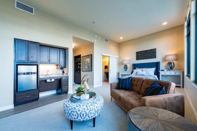 Modern interior of a resident suite with living area and kitchenette