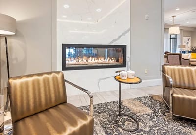 Stylish common area with a fireplace and seating