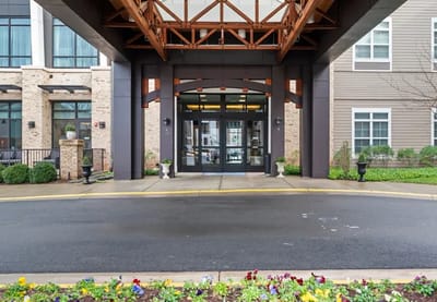 Entrance area of a senior living facility with flowers