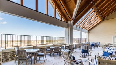 Outdoor terrace area with seating and view