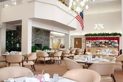 Bright dining area with tables and chairs
