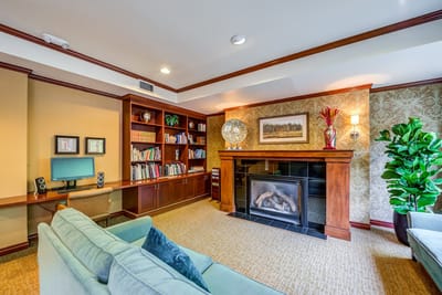 Cozy interior of a common area with bookshelves and seating