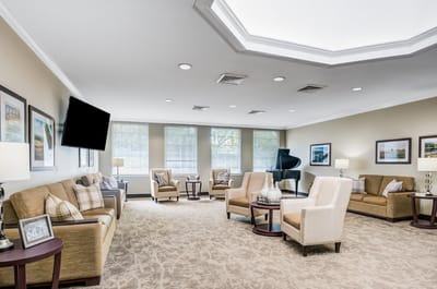 Common area with seating and a grand piano