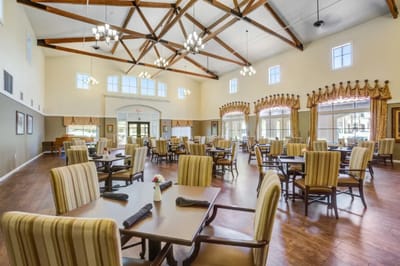 Bright dining room with wooden beams and ample seating