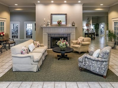 Interior common area with seating and a fireplace