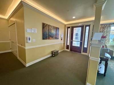Bright lobby area with artwork and seating