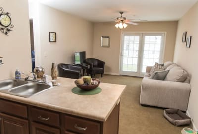 Cozy interior living space with seating and television