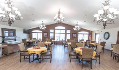 Dining room with tables set for residents