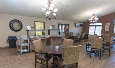 Dining area with tables and food serving station