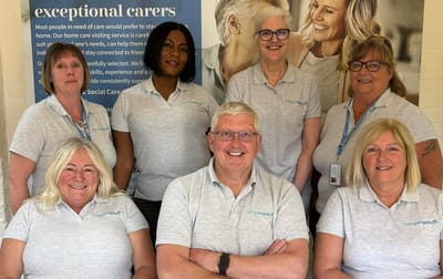 Care staff smiling in their workplace