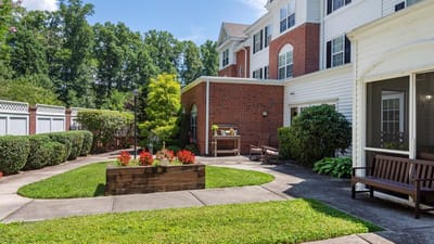 Outdoor garden area with benches and landscaping