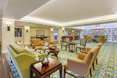 Interior view of a well-furnished common area in a senior living facility