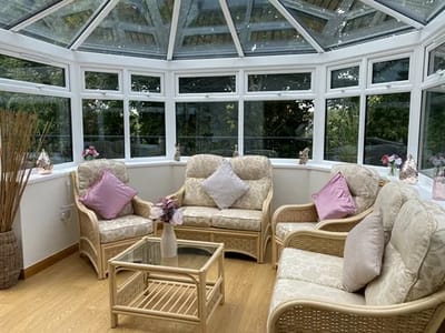 Sunroom with comfortable seating and natural light