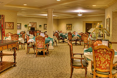 Dining area with ornate chairs and tables