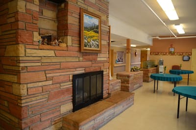 Interior view of a communal gathering area with a fireplace