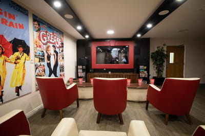 Interior view of a cozy common area with movie-themed decor