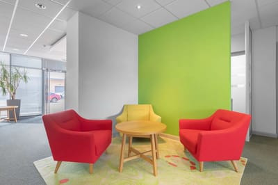 Brightly colored lounge area with chairs and table