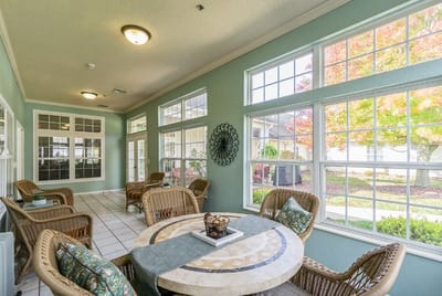 Bright common area with seating and large windows