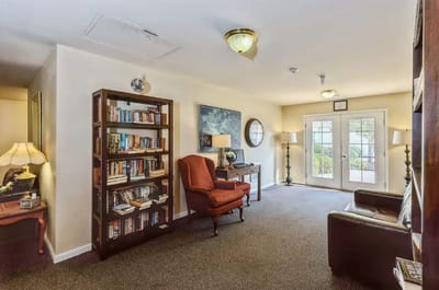 Comfortable lounge area with bookshelves and seating