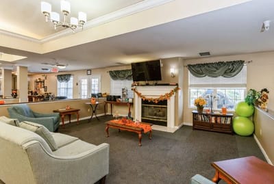 Common area with seating and decorations for fall