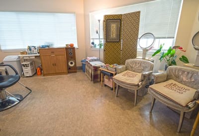 Comfortable salon space with seating and decor