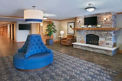 Interior view of a cozy lounge area with a fireplace