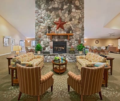 Interior common area with seating and a fireplace