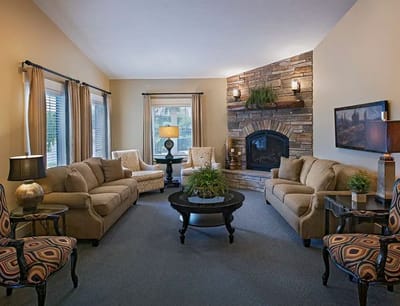 Cozy common area with seating and a fireplace