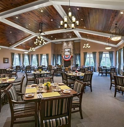 Dining room with tables set for residents
