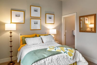 Cozy bedroom with decorative wall art and bedding
