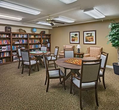 Cozy common area with bookshelves and seating