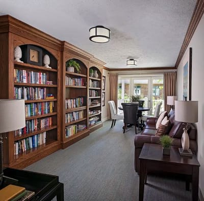 Interior view of a common area with bookshelves and seating