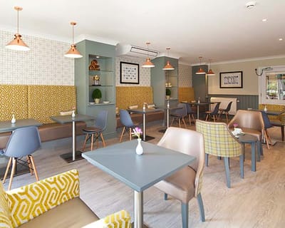 Bright dining area with tables and chairs