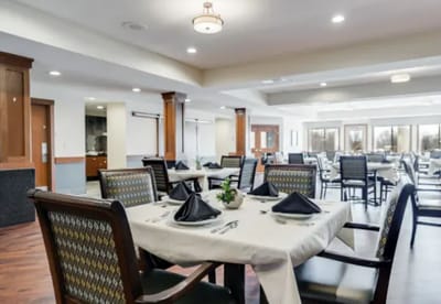 Well-set dining room with elegant tables and chairs