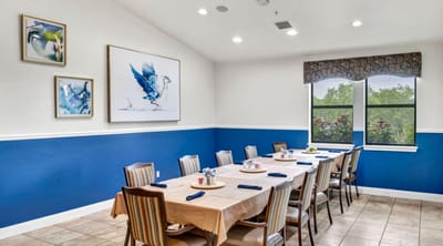 Bright dining room with tables set for a meal