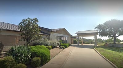 Exterior view of the Arbor House facility with landscaping