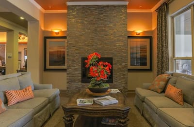 Cozy common area with seating and a floral centerpiece