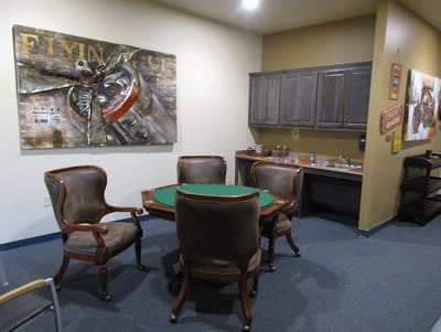 Interior common area with poker table and seating