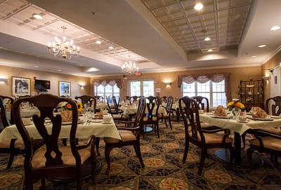 Elegant dining room with tables set for a meal