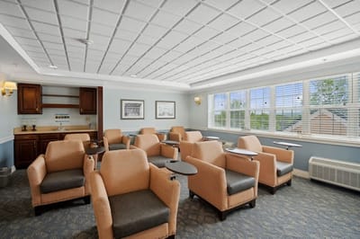 Bright common area with seating for residents