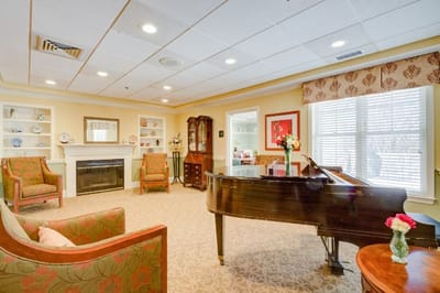 Bright and welcoming common area with piano