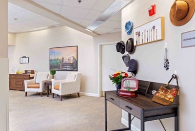 A cozy lounge area with chairs and decorations