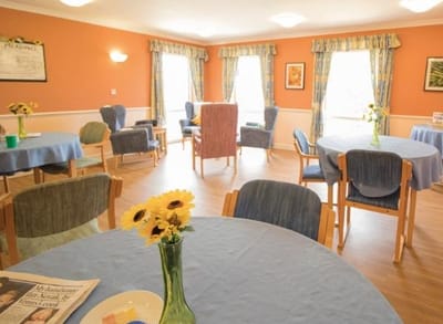 Bright common area with tables and chairs