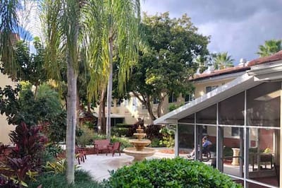 Outdoor courtyard with seating and a fountain