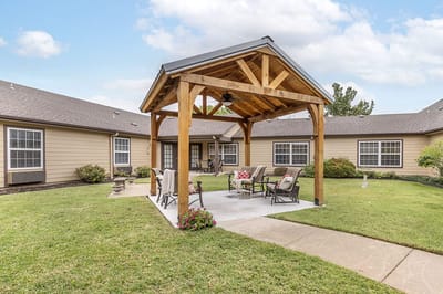 Outdoor seating area with a wooden gazebo