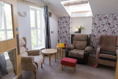 A cozy lounge area with comfortable armchairs